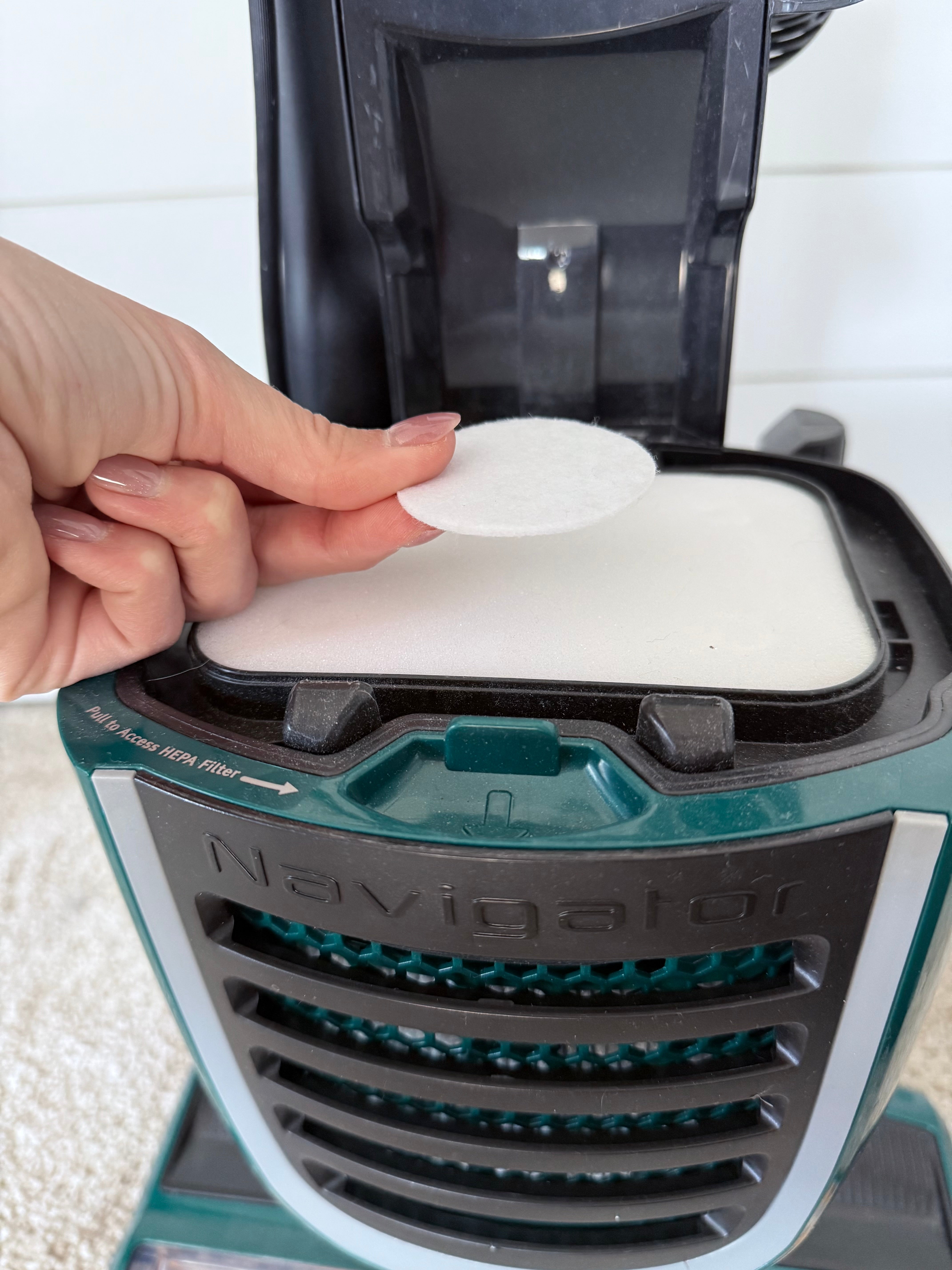 Place vacuum fragrance pad on filter - SweepScents